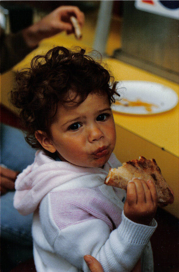 a child eating pizza